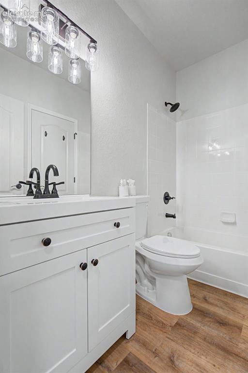 5353 Palomino Ranch Point, Unit 307 Colorado Springs, CO 80922 - Photo 15 of 30 Adjoining bathroom with a white vanity with dark hardware