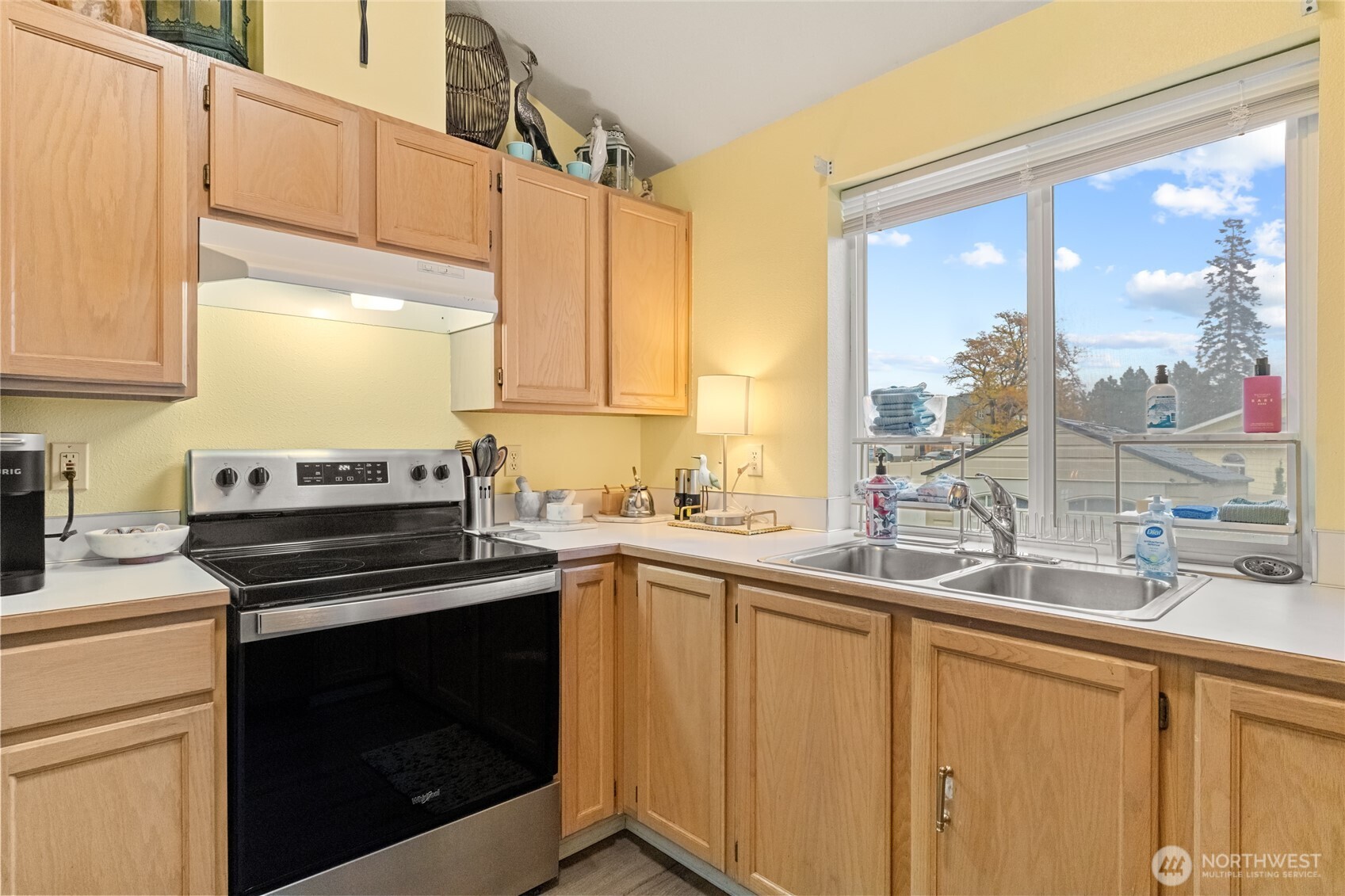 1501 Angela Street Wenatchee, WA 98801 - Photo 13 of 30 a kitchen with a sink stove and cabinets