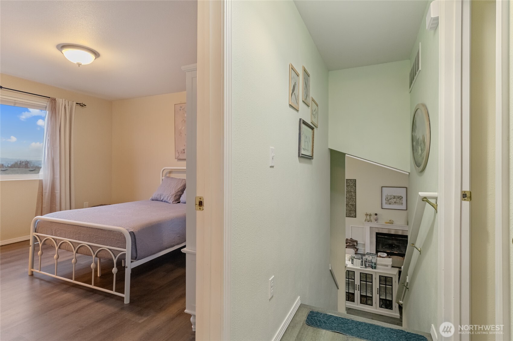 1501 Angela Street Wenatchee, WA 98801 - Photo 14 of 30 a bedroom with a bed and a tv on the dresser