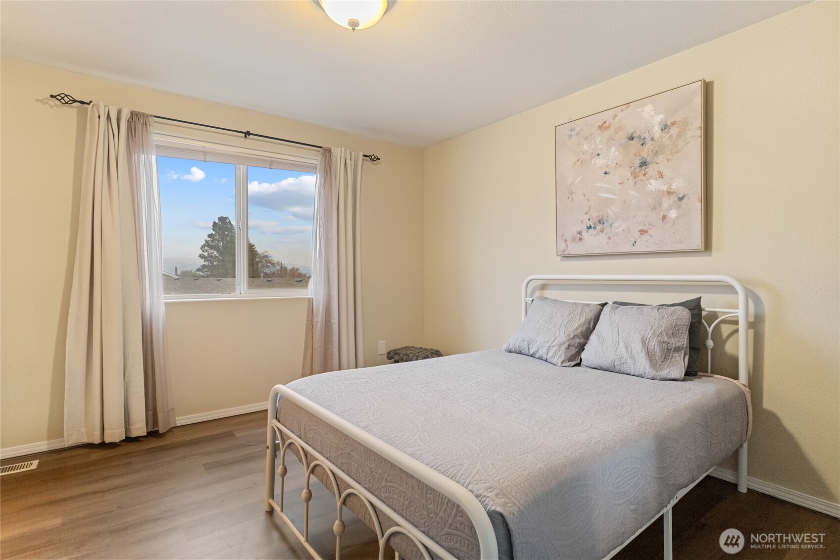 1501 Angela Street Wenatchee, WA 98801 - Photo 15 of 30 a bedroom with a large bed and a window