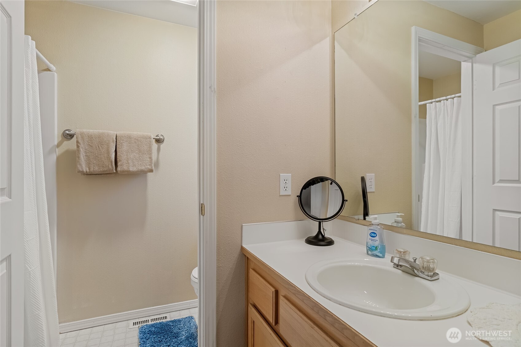 1501 Angela Street Wenatchee, WA 98801 - Photo 17 of 30 a bathroom with a sink and mirror