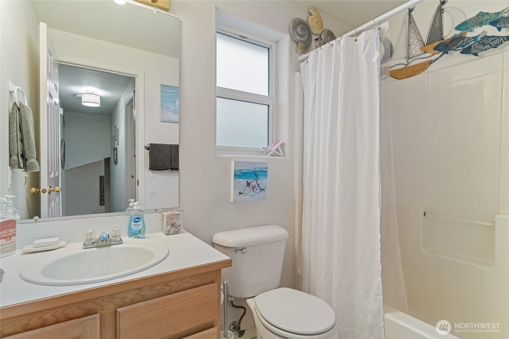 1501 Angela Street Wenatchee, WA 98801 - Photo 20 of 30 a bathroom with a sink a toilet a mirror and shower
