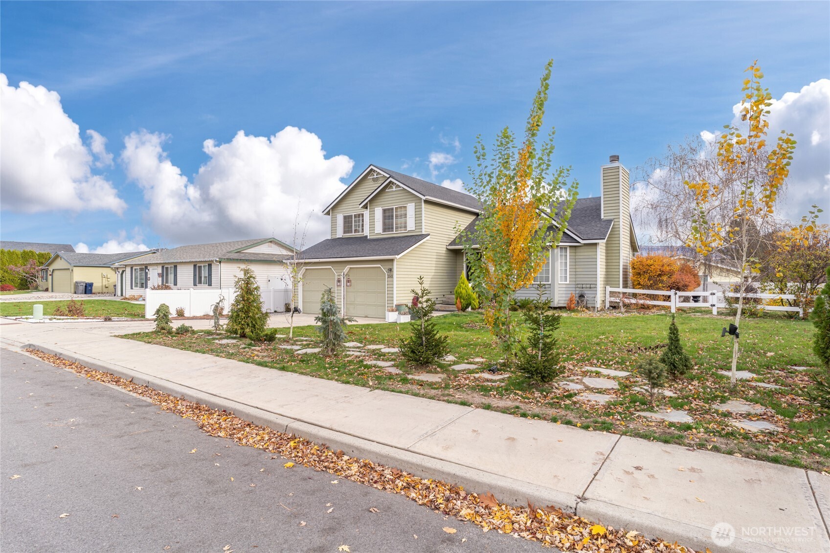 1501 Angela Street Wenatchee, WA 98801 - Photo 25 of 30 a front view of a house with a yard and potted plants