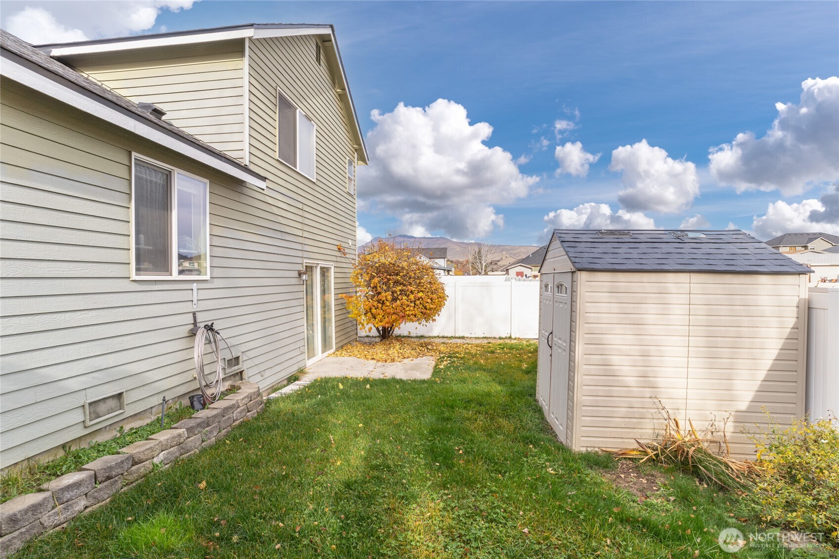 1501 Angela Street Wenatchee, WA 98801 - Photo 29 of 30 a view of a backyard with plants and large tree
