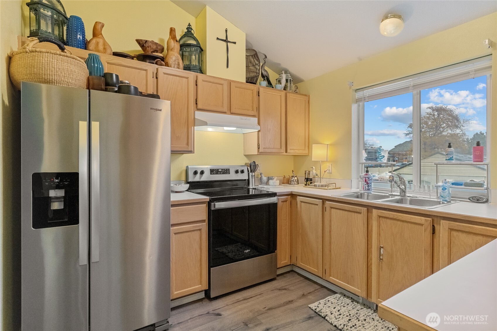 1501 Angela Street Wenatchee, WA 98801 - Photo 8 of 30 a kitchen with stainless steel appliances a refrigerator sink and cabinets