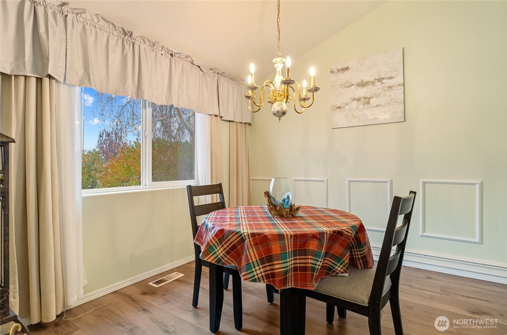 1501 Angela Street Wenatchee, WA 98801 - Photo 10 of 30 a view of a dining room with furniture a chandelier and wooden floor