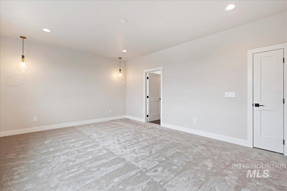 1297 West Malbar Street Meridian, ID 83646 - Photo 18 of 34 Spacious room featuring light gray carpeting and recessed ceiling lighting