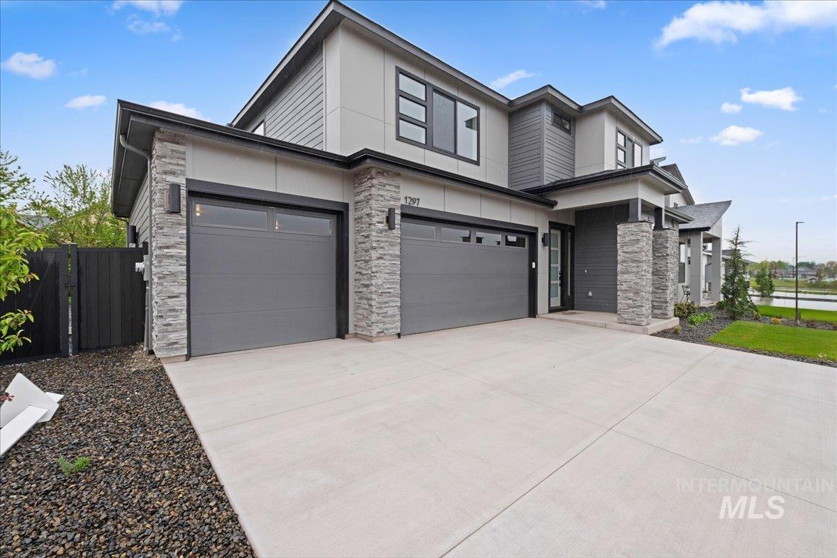 1297 West Malbar Street Meridian, ID 83646 - Photo 4 of 34 Contemporary exterior featuring multi-level siding and stone accents