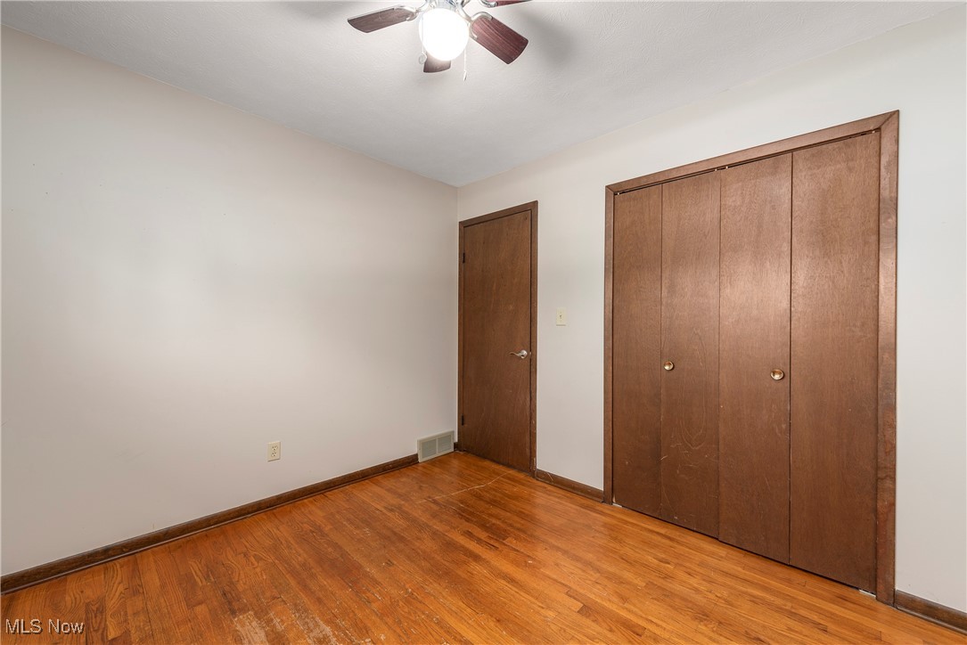 7717 Hoertz Road Cleveland, OH 44134 - Photo 21 of 49 Unfurnished bedroom with a closet, ceiling fan, and light wood-type flooring
