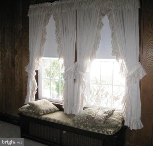 2121 White Hall Road White Hall, MD 21161 - Photo 9 of 20 a bedroom with furniture and a window