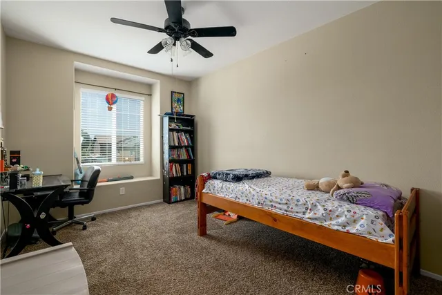 a bedroom with furniture and a window