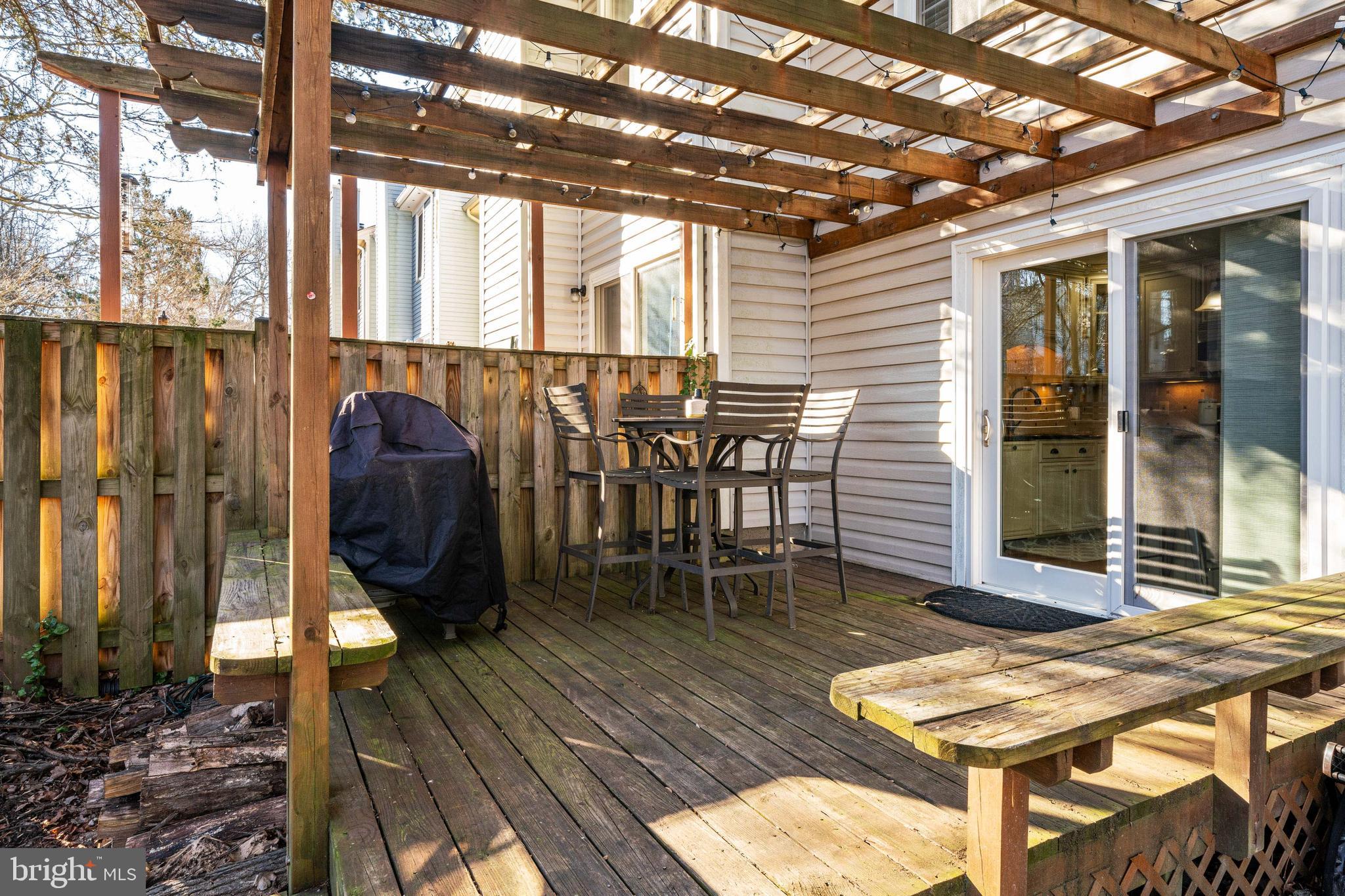 7251 Kousa Lane Springfield, VA 22152 - Photo 27 of 31 Wood deck with pergola w/ steps to STONE patio!