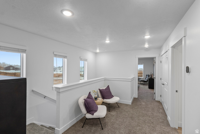 3003 South 265th Street West, Unit 751 Logan, UT 84321 - Photo 18 of 29 Living area with light colored carpet and recessed lighting