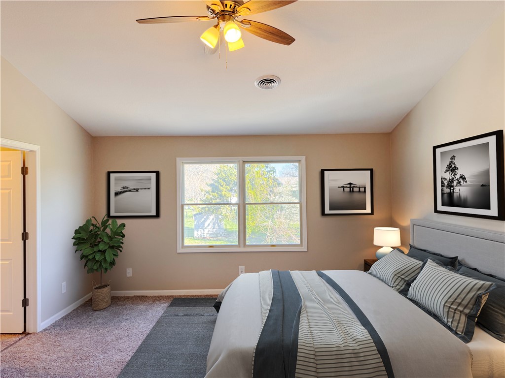 1118 Wedgewood Court Decatur, IL 62526 - Photo 14 of 22 a bedroom with a bed and a painting on the wall