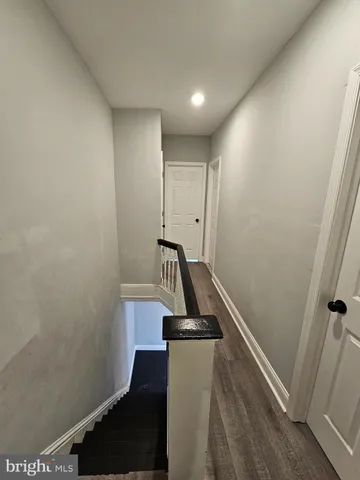 a view of a hallway with staircase