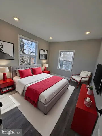 a bedroom with a bed and window