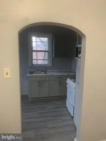a kitchen with a sink and a microwave