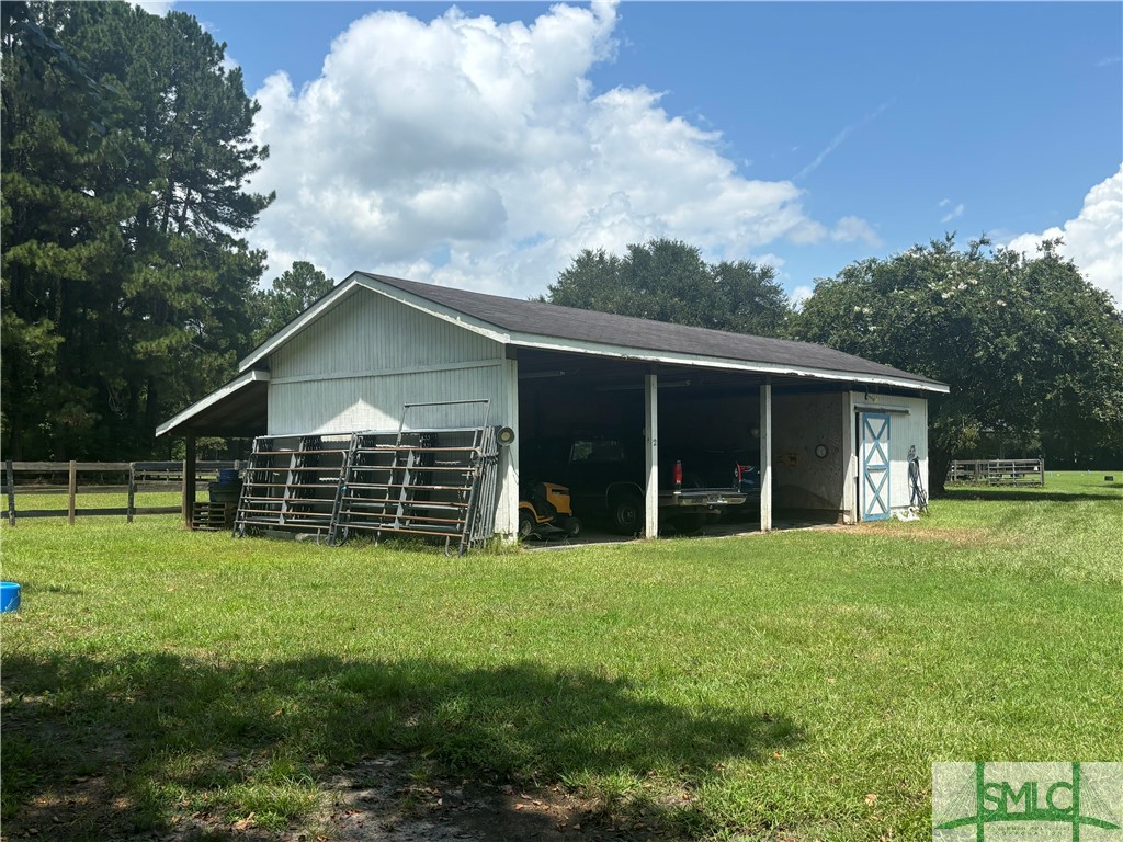 910 Kolic Helmey Road Guyton, GA 31312 - Photo 17 of 40 Implement shed and wellhouse