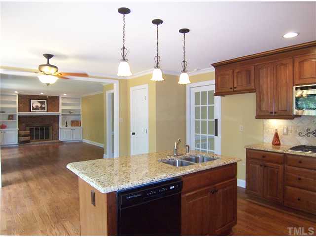 6905 Brook Ridge Court Raleigh, NC 27615 - Photo 11 of 25 This view from the Kitchen shows how open it is to the Family Rm.