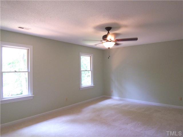6905 Brook Ridge Court Raleigh, NC 27615 - Photo 16 of 25 Lg Master Bedroom offers neutral carpet, 3 closets & redone private Bath.