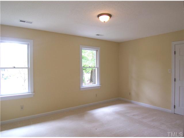 6905 Brook Ridge Court Raleigh, NC 27615 - Photo 19 of 25 3 more spacious Bedrooms w/neutral carpet, NEW light fixtures & lg closets (BR4 has a lg WIC and BR3 has 2 closets) share the spacious hall Bath. This is Bedroom 2.