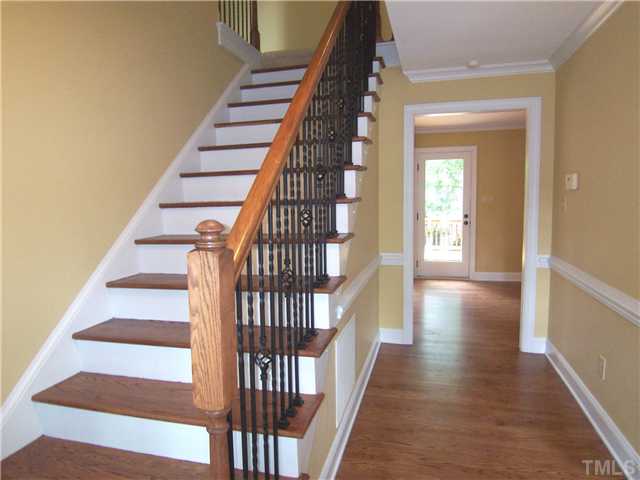 6905 Brook Ridge Court Raleigh, NC 27615 - Photo 2 of 25 Totally UPDATED home features NEW oil-rubbed bronze fittings & fixtures, redone hrdwd flrs, crown molding & maintenance-free brick exterior! Gracious Foyer has a deep closet, NEW hardwood flr & NEW wrought iron stair balusters.