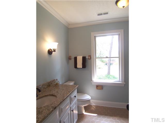 6905 Brook Ridge Court Raleigh, NC 27615 - Photo 22 of 25 Spacious hall Bath features granite ctr, NEW light fixtures & mirror and neutral tile on floor & tub surround.