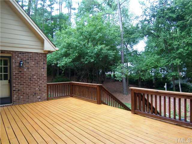 6905 Brook Ridge Court Raleigh, NC 27615 - Photo 23 of 25 The spacious Deck features NEW decking boards and is accessed from the Family Rm, Kitchen, Laundry Rm & backyard.