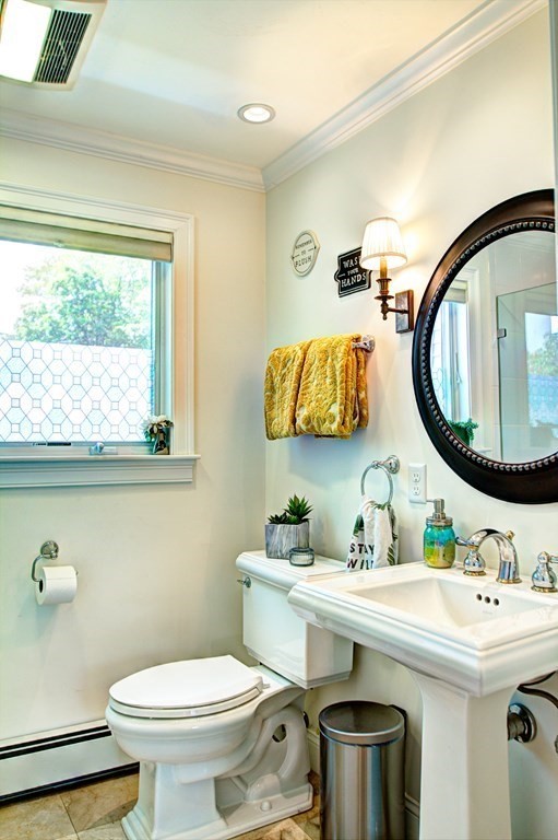 5 3rd Street Ayer, MA 01432 - Photo 17 of 42 a bathroom with a sink a mirror a toilet and a window
