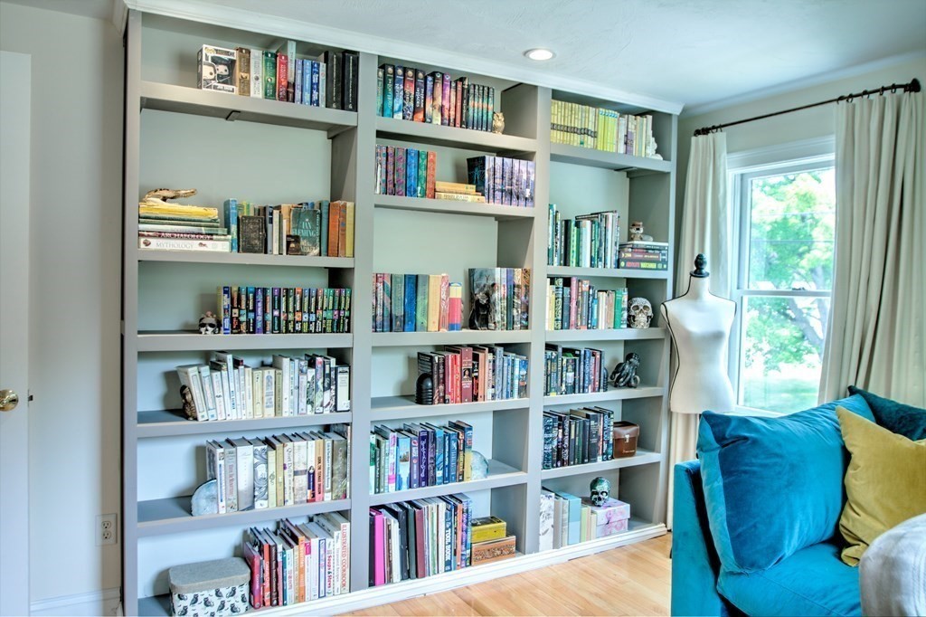 5 3rd Street Ayer, MA 01432 - Photo 18 of 42 a living room with furniture cabinets and a book shelf