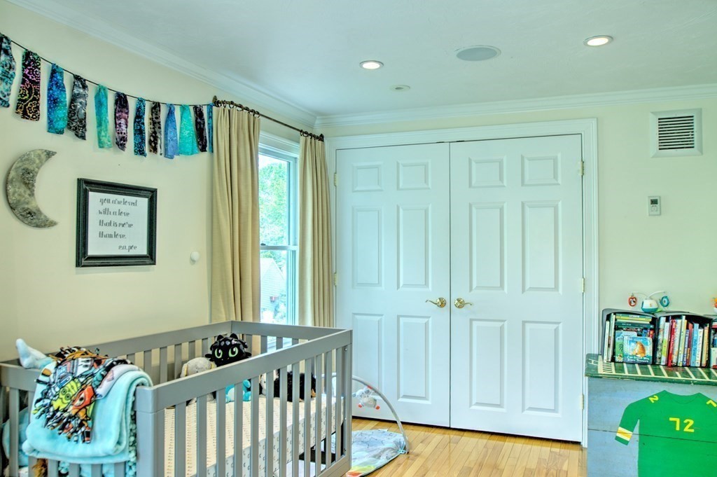 5 3rd Street Ayer, MA 01432 - Photo 22 of 42 a bedroom with furniture and baby crib