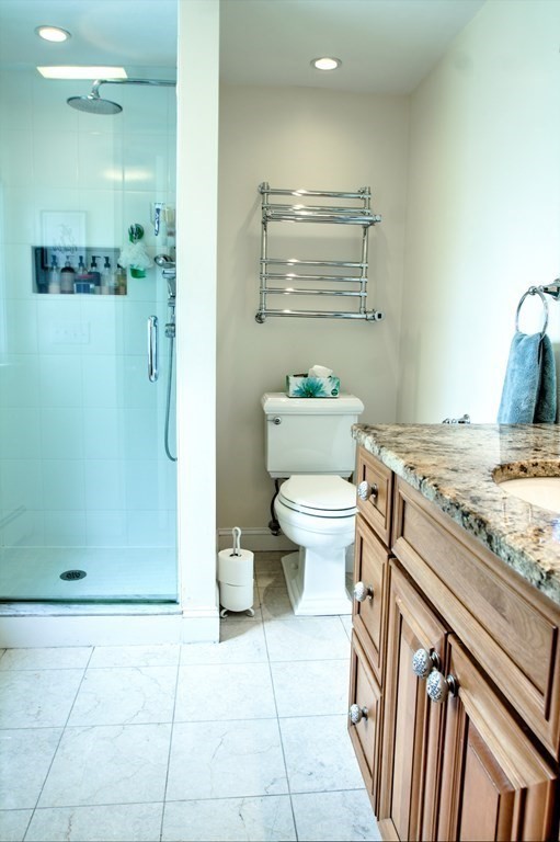 5 3rd Street Ayer, MA 01432 - Photo 27 of 42 a bathroom with a granite countertop sink a toilet and a shower