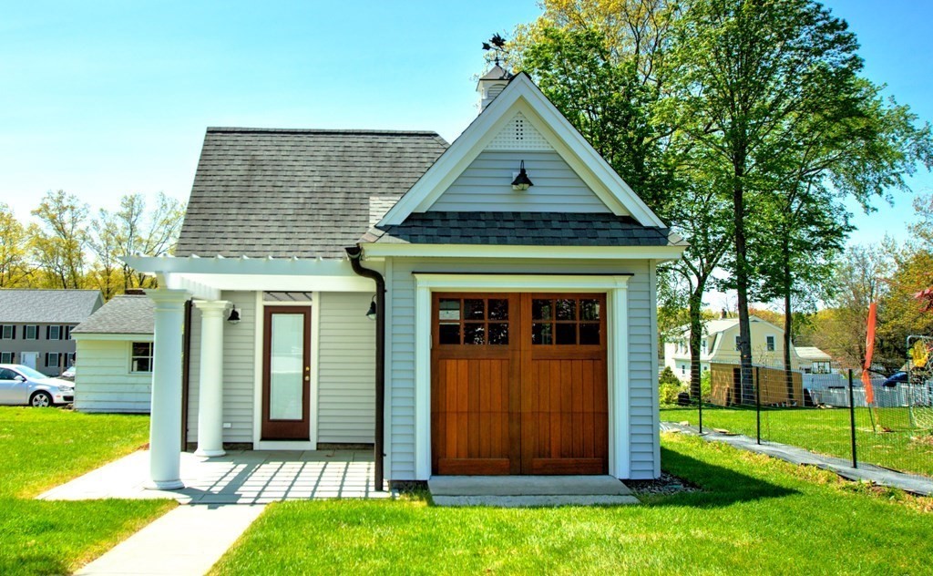 5 3rd Street Ayer, MA 01432 - Photo 29 of 42 a front view of a house with garden