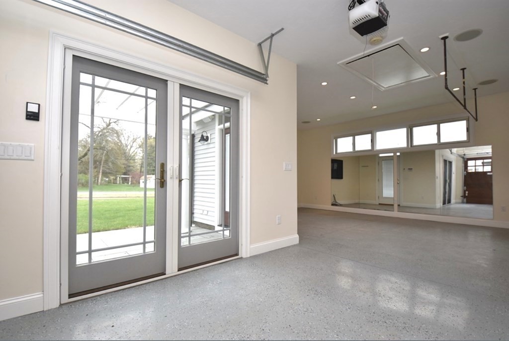 5 3rd Street Ayer, MA 01432 - Photo 30 of 42 a view of a room with sliding glass door and a floor to ceiling window