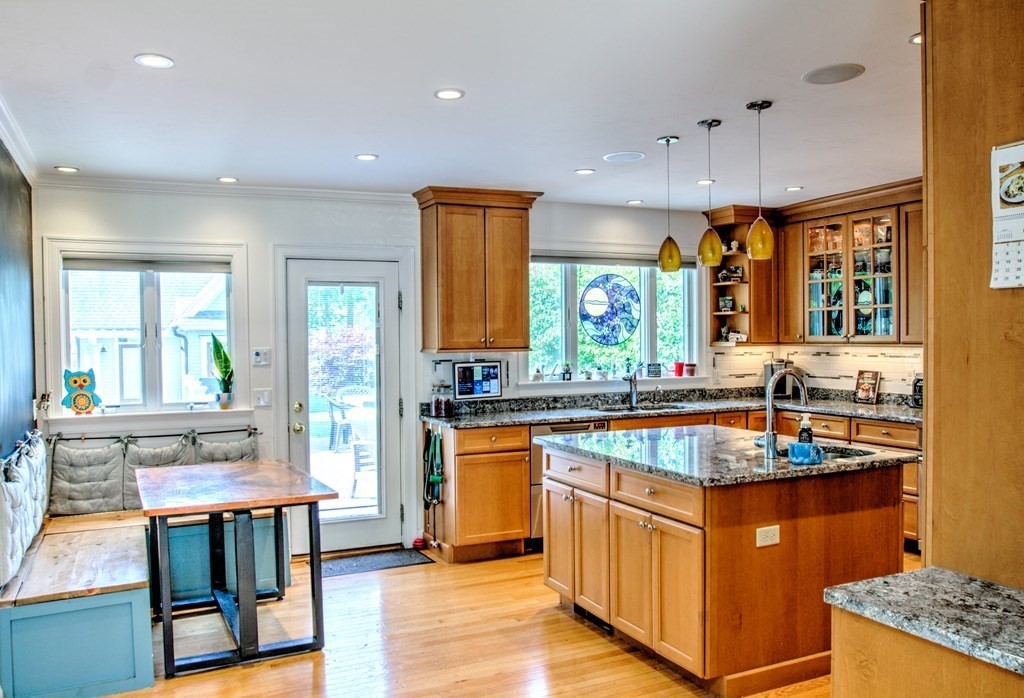 5 3rd Street Ayer, MA 01432 - Photo 3 of 42 a kitchen with granite countertop sink stove and cabinets
