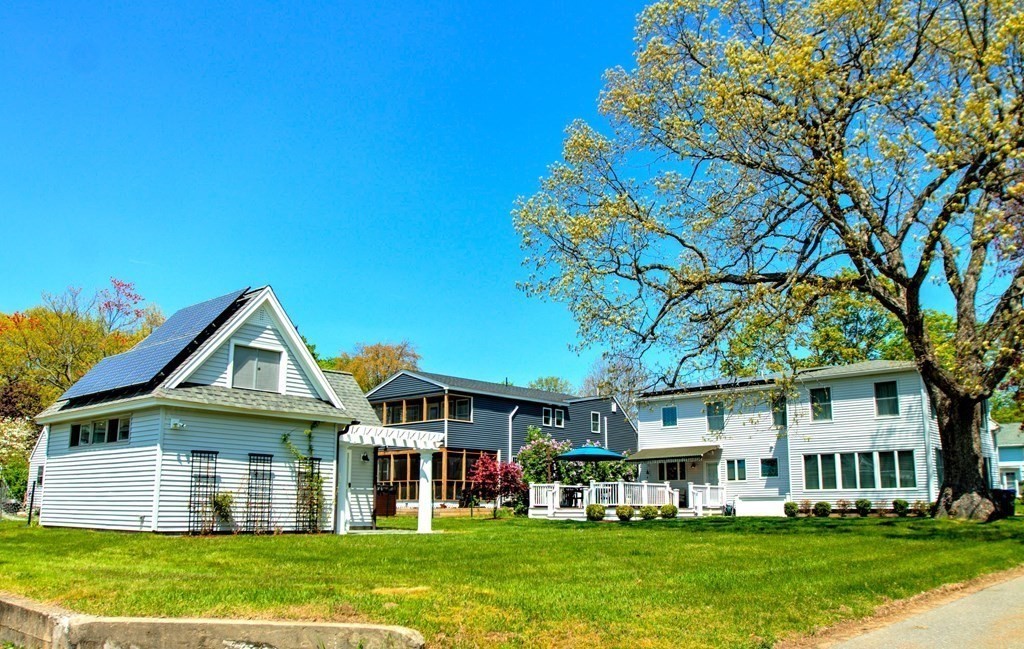 5 3rd Street Ayer, MA 01432 - Photo 36 of 42 a front view of a house with a garden