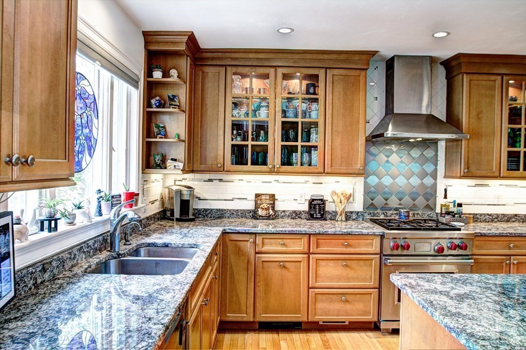 5 3rd Street Ayer, MA 01432 - Photo 6 of 42 a kitchen with stainless steel appliances granite countertop a sink stove and cabinets