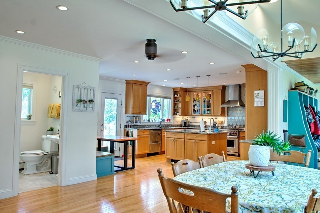 5 3rd Street Ayer, MA 01432 - Photo 9 of 42 a kitchen with lots of counter top space and wooden floor