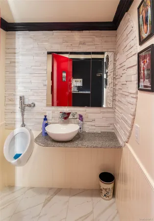 a red brick building sitting in front of a house