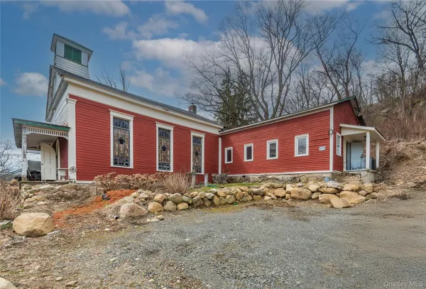 a front view of a house with a porch