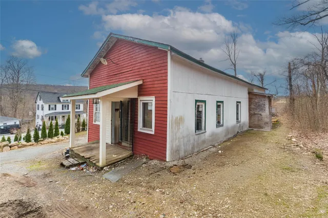 a front view of a house with a porch
