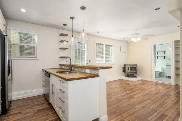 a view of a kitchen with wooden floor