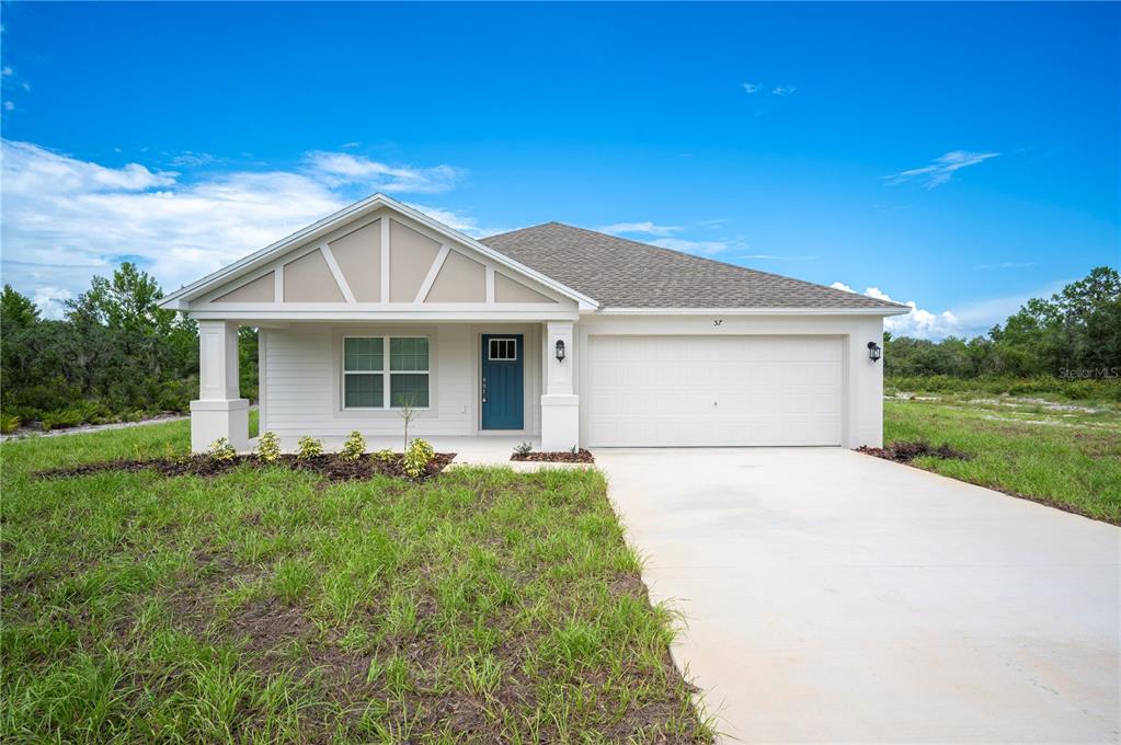 57 Deer Road Frostproof, FL 33843 - Photo 1 of 1 a front view of a house with a yard