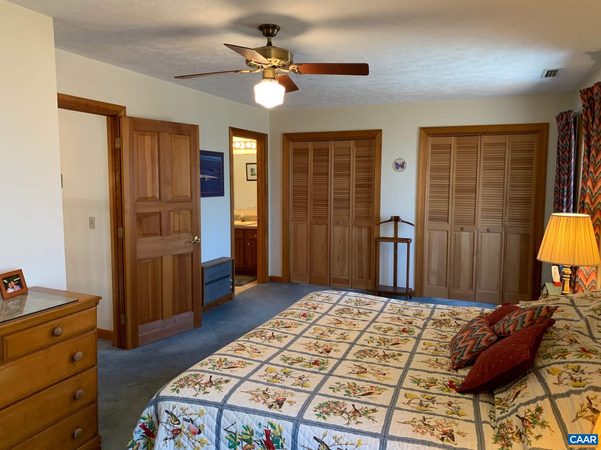 2765 Seville Road Madison, VA 22727 - Photo 24 of 50 a bedroom with a bed and wooden floor