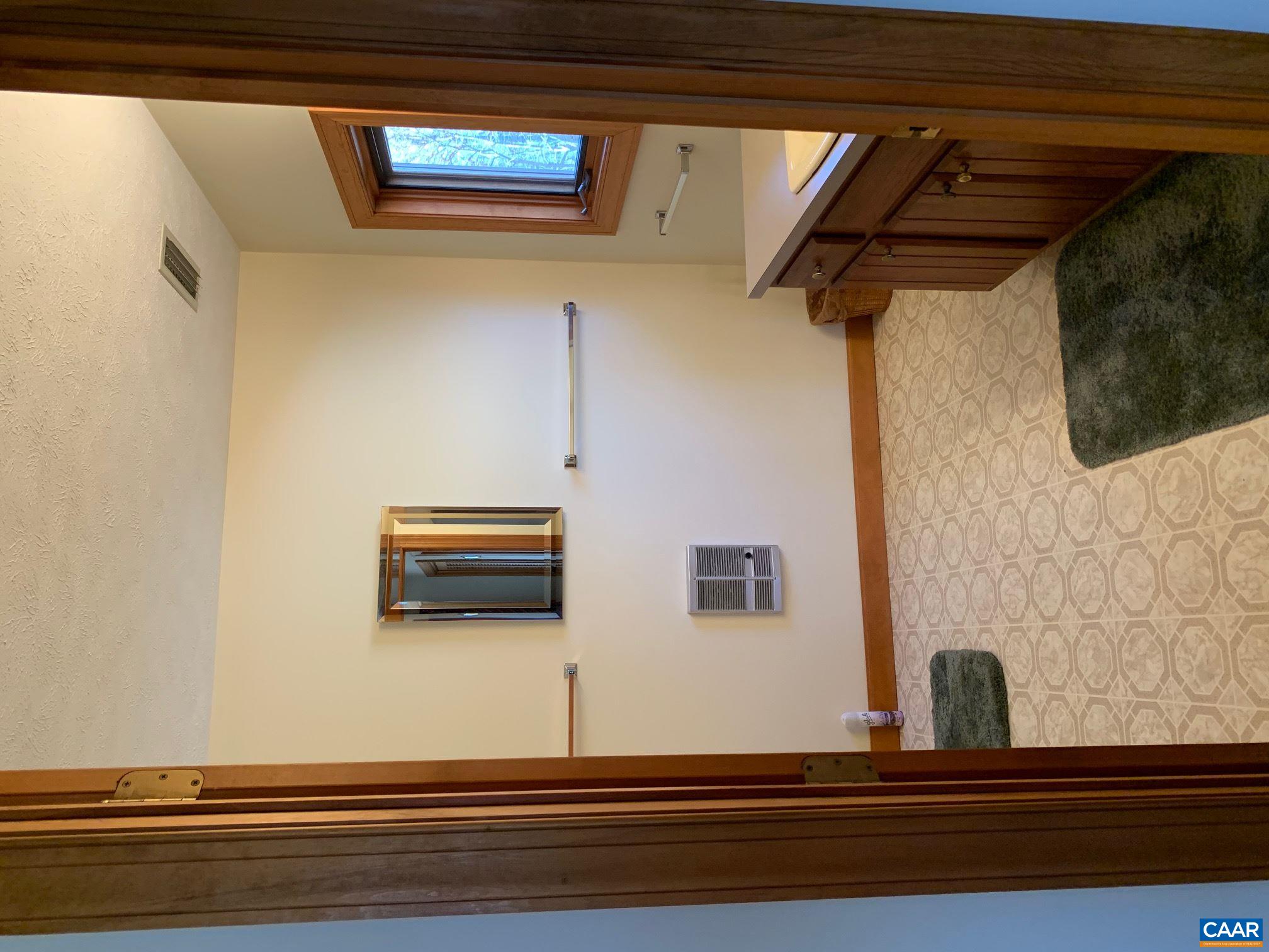 2765 Seville Road Madison, VA 22727 - Photo 25 of 50 a bathroom with a sink a toilet and mirror