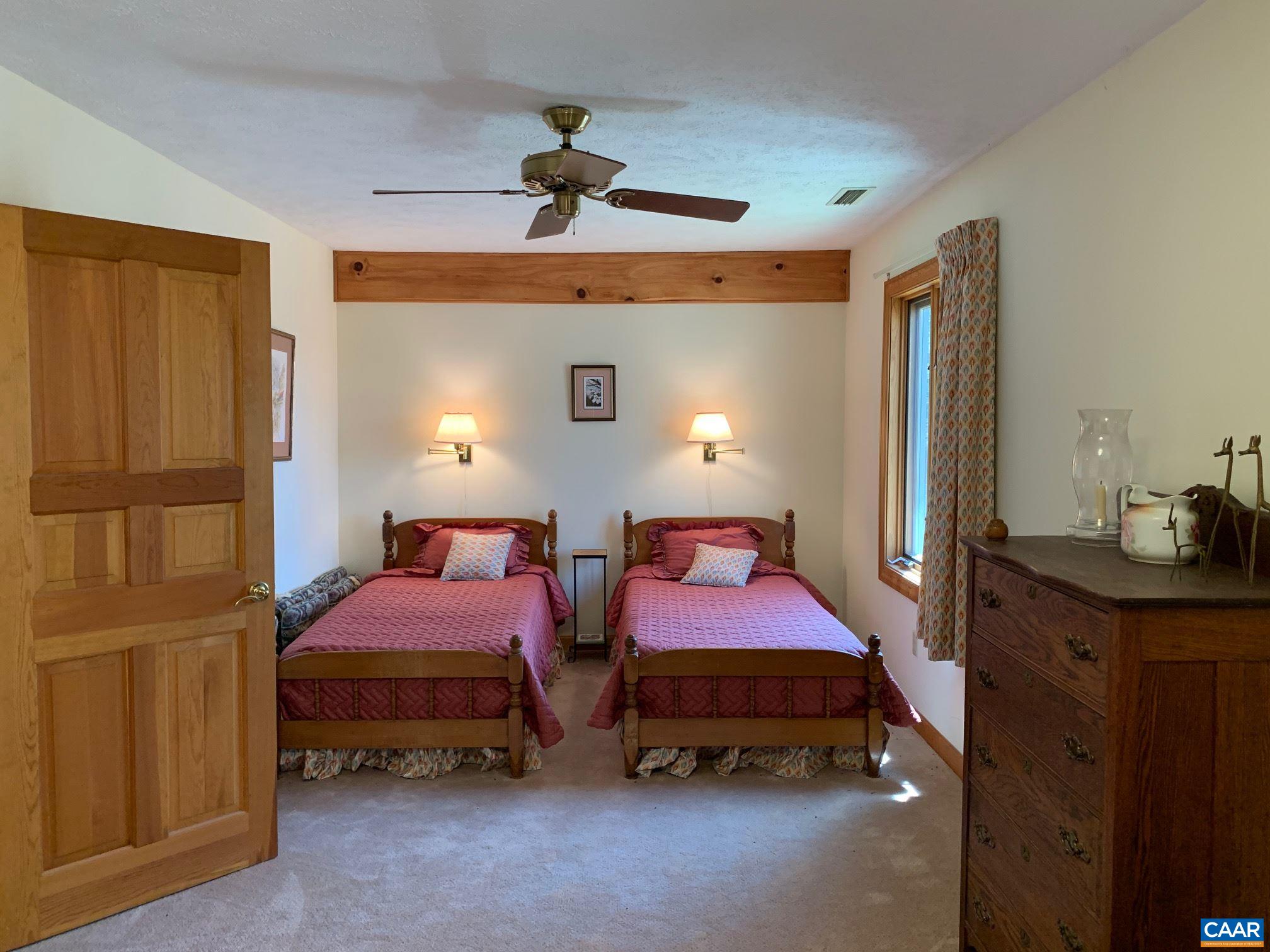 2765 Seville Road Madison, VA 22727 - Photo 29 of 50 a bedroom with two beds and a lamp