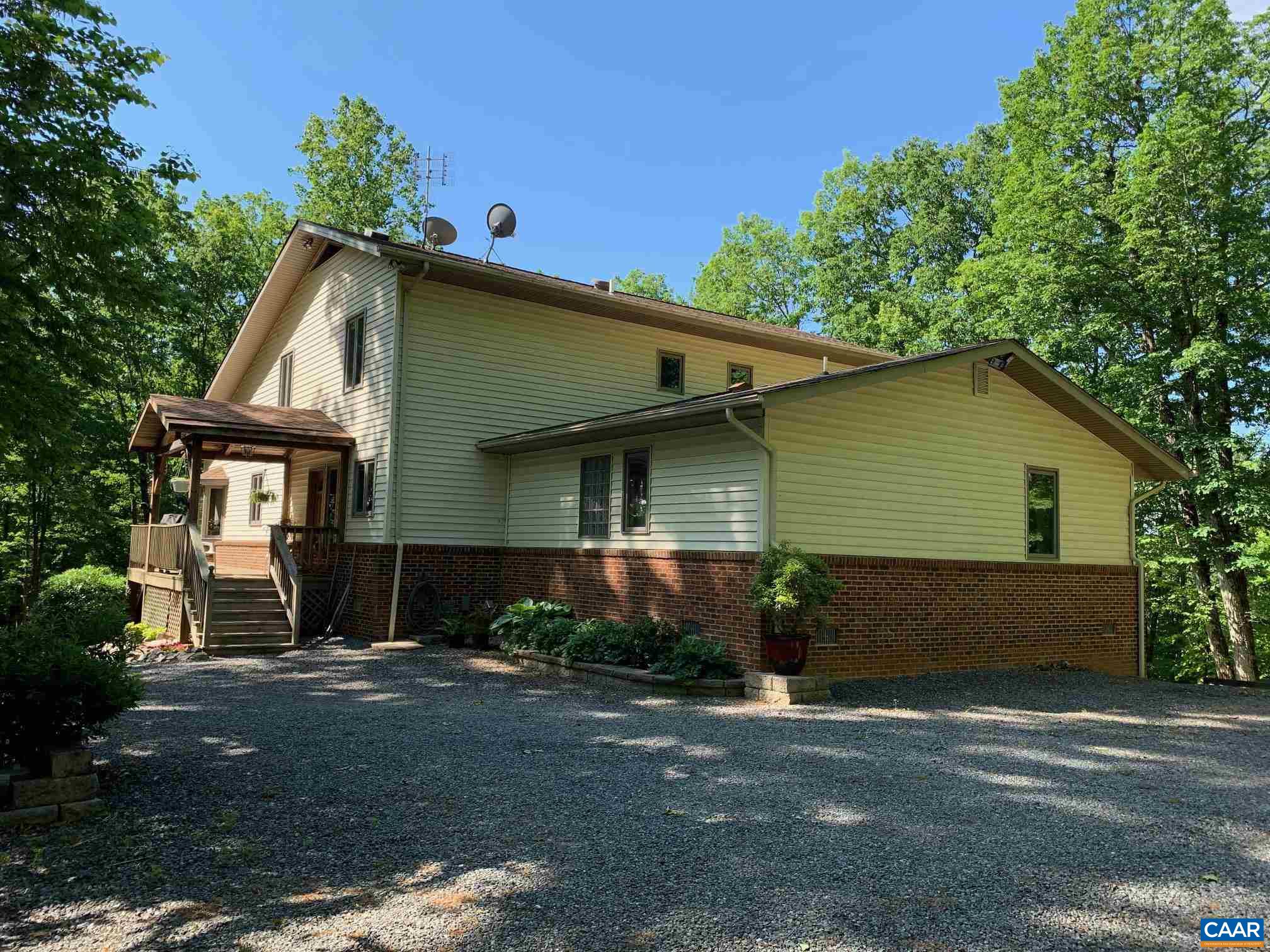 2765 Seville Road Madison, VA 22727 - Photo 50 of 50 a front view of a house with a yard and garage