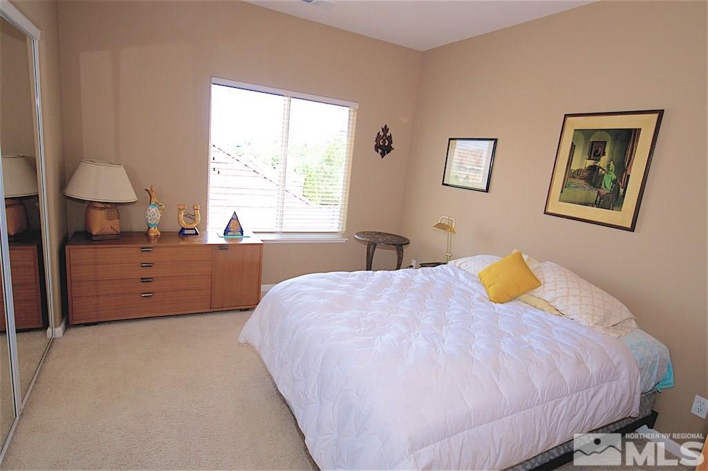 1820 Hunter Creek Road Reno, NV 89519 - Photo 16 of 22 a bedroom with a bed and a window