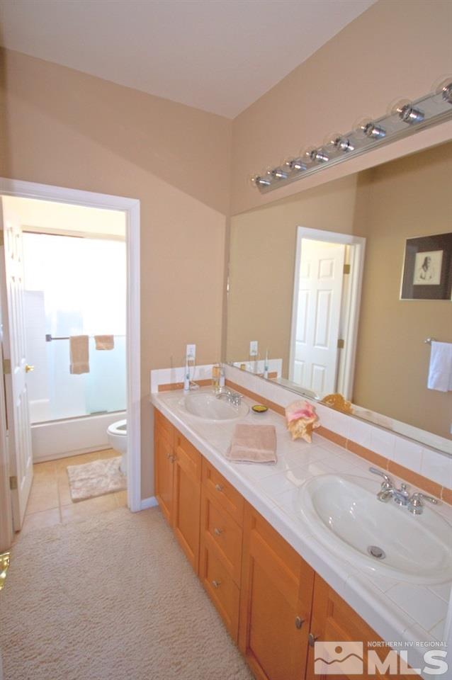1820 Hunter Creek Road Reno, NV 89519 - Photo 18 of 22 a spacious bathroom with a tub sink and mirror