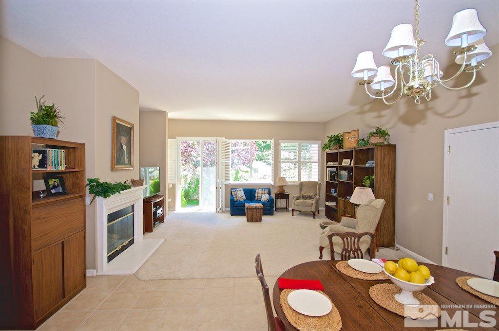 1820 Hunter Creek Road Reno, NV 89519 - Photo 6 of 22 a view of a dining room with furniture a rug and wooden floor
